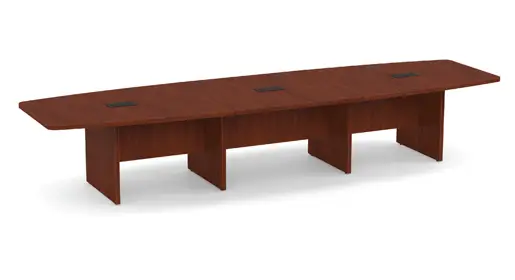 COE expansive boat-shaped conference table with a rich cherry wood laminate top, integrated power grommets, and sturdy panel bases, presented in a clean white studio setting. Perfect for executive boardrooms as part of Office Furniture Connection's premium selection of office tables in Houston TX.