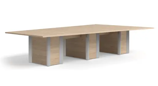 Logiflex Howard wide rectangular conference table with a neutral light oak laminate top and multiple modern panel-style bases incorporating silver accents, displayed in a minimalist white studio environment. Spacious solution for large teams from Office Furniture Connection's range of office tables serving Texas and Louisiana clients.