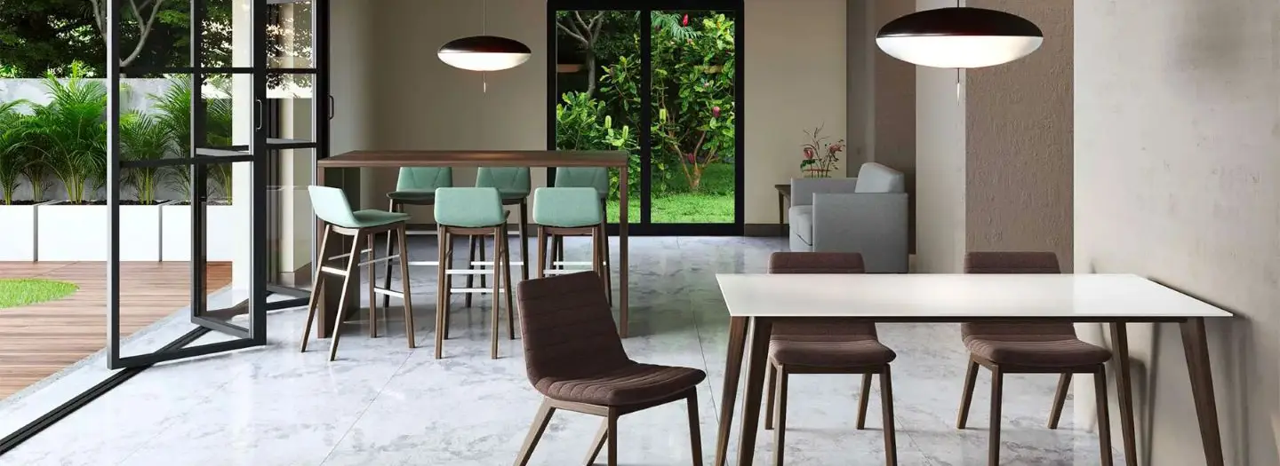 HERO: Light-filled modern office cafe and lounge with high walnut bar table, mint upholstered bar stools, white dining table with brown quilted chairs and floor-to-ceiling garden views for relaxed hybrid collaboration and team focus spaces