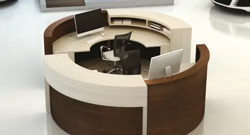 Round lobby desk with cream and wood laminate modular counters, with ample hidden storage and eco-sourced materials for creative open hybrid reception or showroom areas
