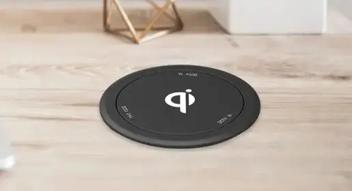 Pop-up wireless and USB charging dock hidden in 3-inch grommet hole with 5W Qi pad, 2×USB-A 1A and USB-C 2.4A ports for discreet fast-charging in worksurfaces