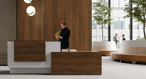 Modern executive conference room with a rectangular 10-seat white laminate top and light wood laminate bases conference table, seven black mesh ergonomic chairs, matching credenza with wall-mounted TV, and large floor-to-ceiling windows overlooking a bay area. Ideal for professional board meetings and client presentations.