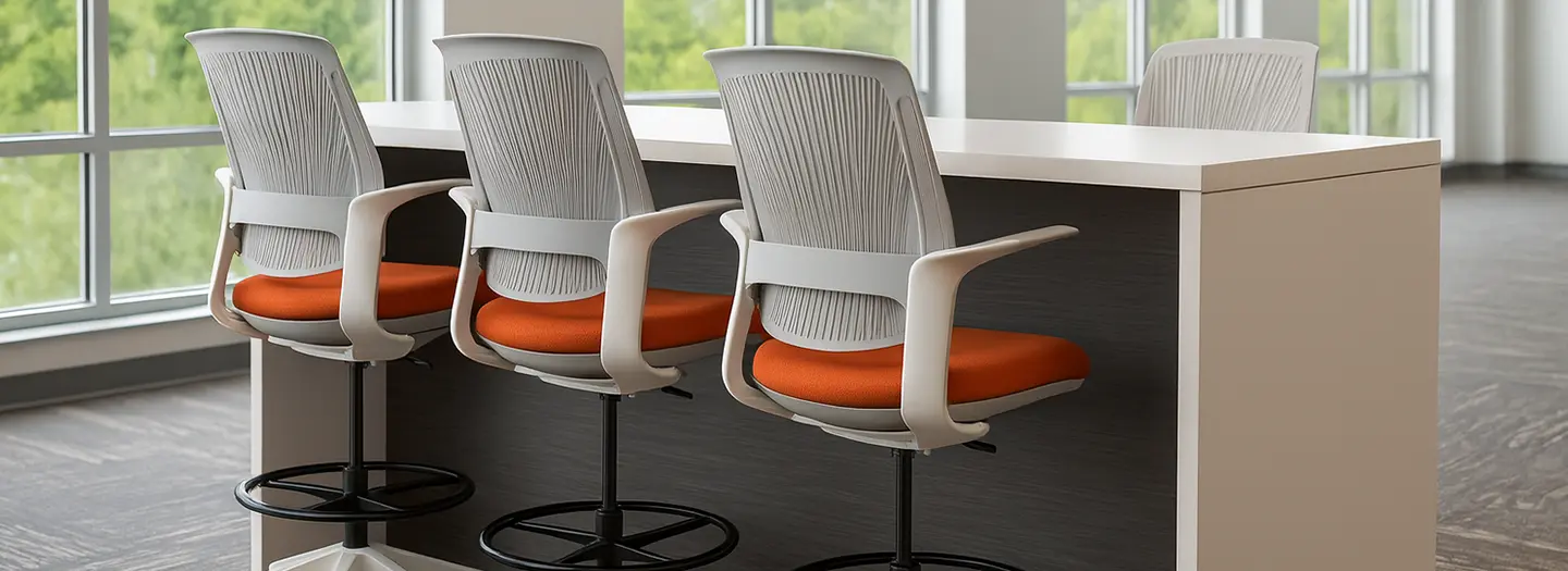 A CONNECT series collaboration table in light wood laminate sits in an open plan office with space for up to six ergonomic stools, three on each side.