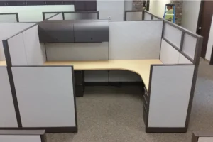Pod of Knoll Morrison remanufactured cubicles with light gray 64" panels featuring 16" frosted glass and 48" panel returns, overhead storage in dark gray with tasklights, light-tone wood laminate worksurfaces, box/box/file pedestals, and dark gray lateral files combining focused work areas with the ability to bring in light.