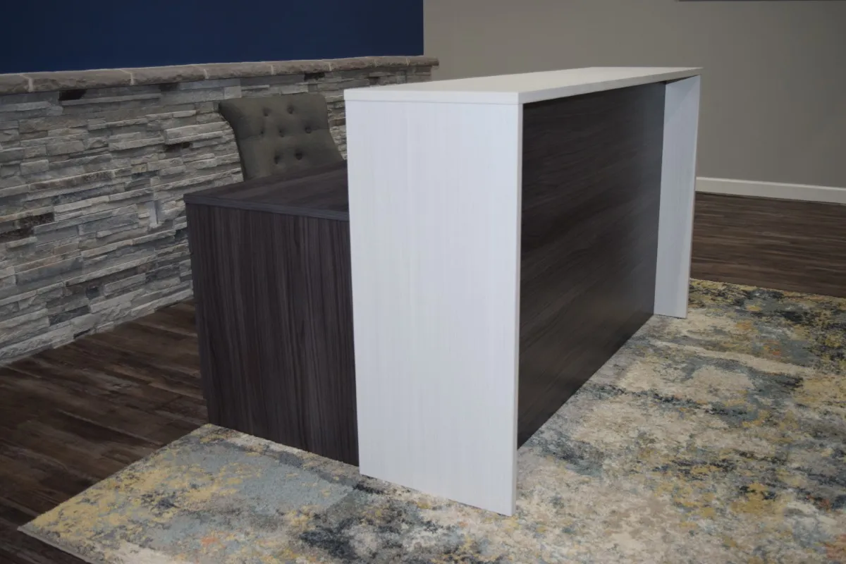 Modern two-tone reception desk from OFC CONNECT Series featuring white solid-surface transaction top, contrasting dark espresso wood laminate panels, and clean waterfall design – sleek affordable front office greeting counters by Office Furniture Connection Houston TX.