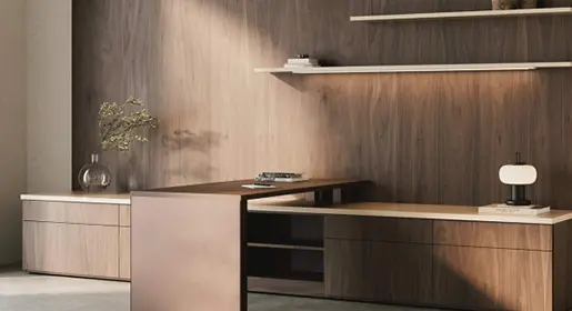 Executive private office with rich walnut L-shaped desk, integrated credenza, floating illuminated shelf, modern task lamp, and minimalist wood panel wall for focused leadership workspace.