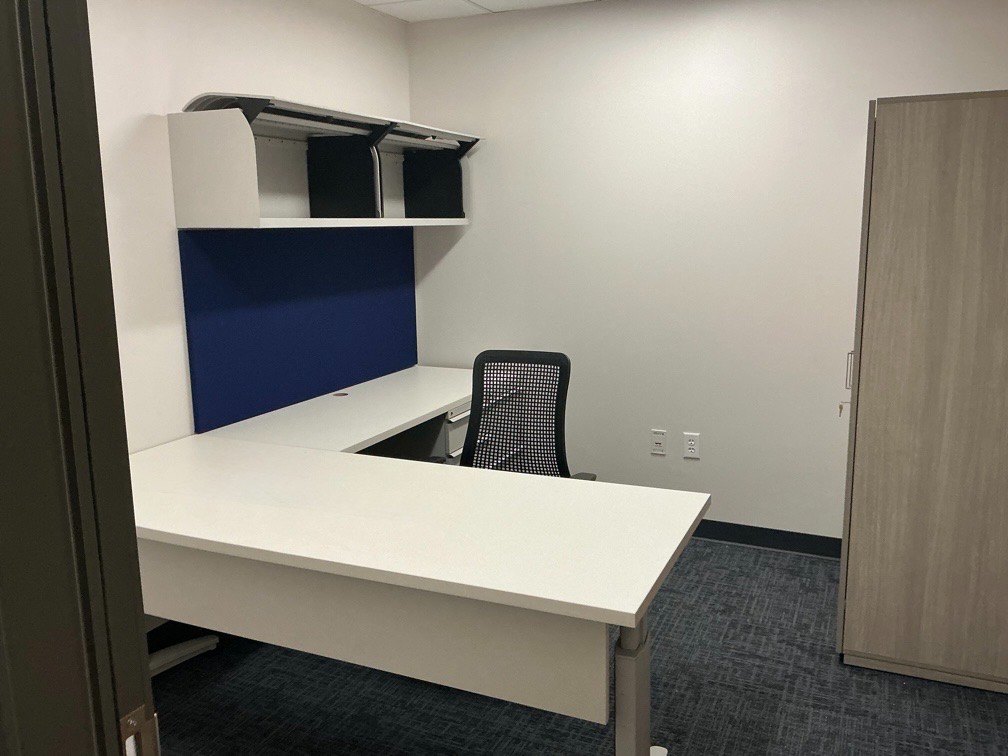 L-shaped desk with restored steel overhead and new laminate surfaces
