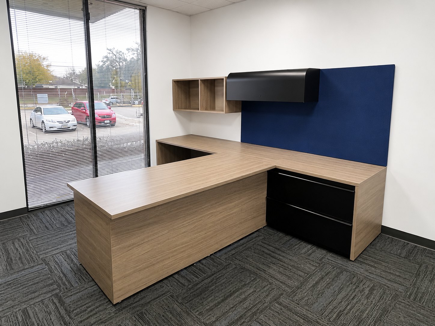 Woodgrain laminate desk with black steel lateral files and overhead