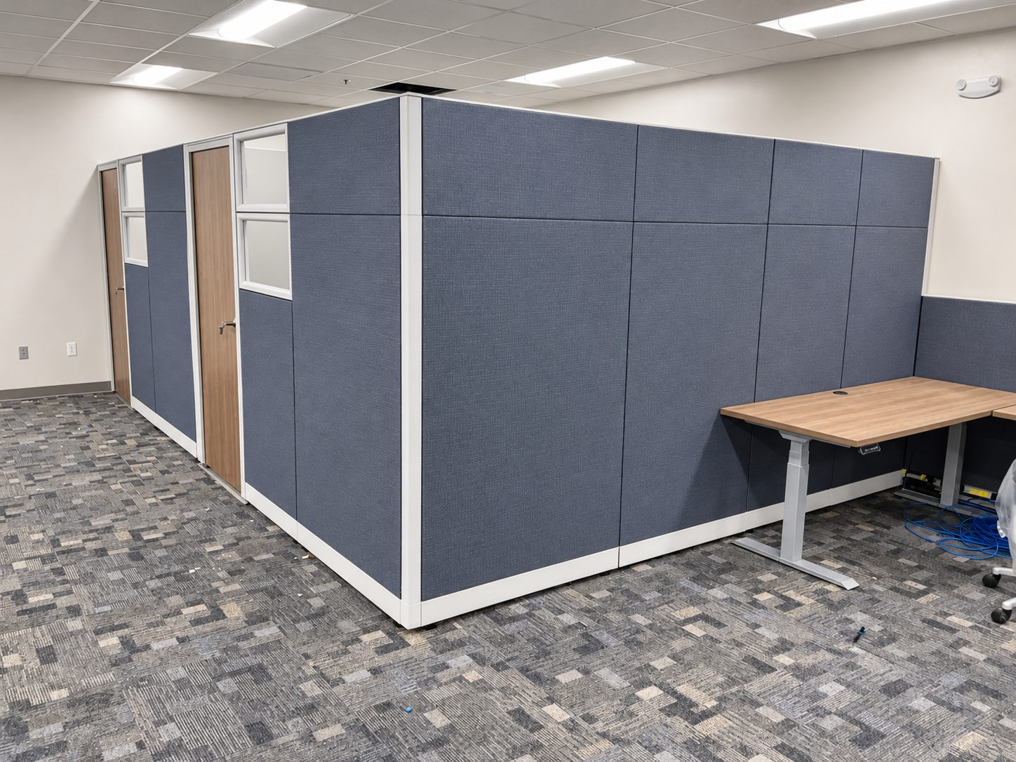 Enclosed private offices built from remanufactured Knoll Morrison panels with lockable doors at Bayou Electrical