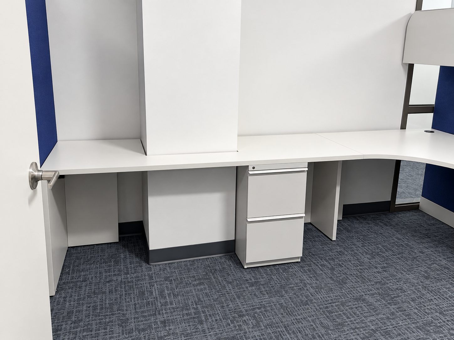Workstation surface modified on site to fit around a building column