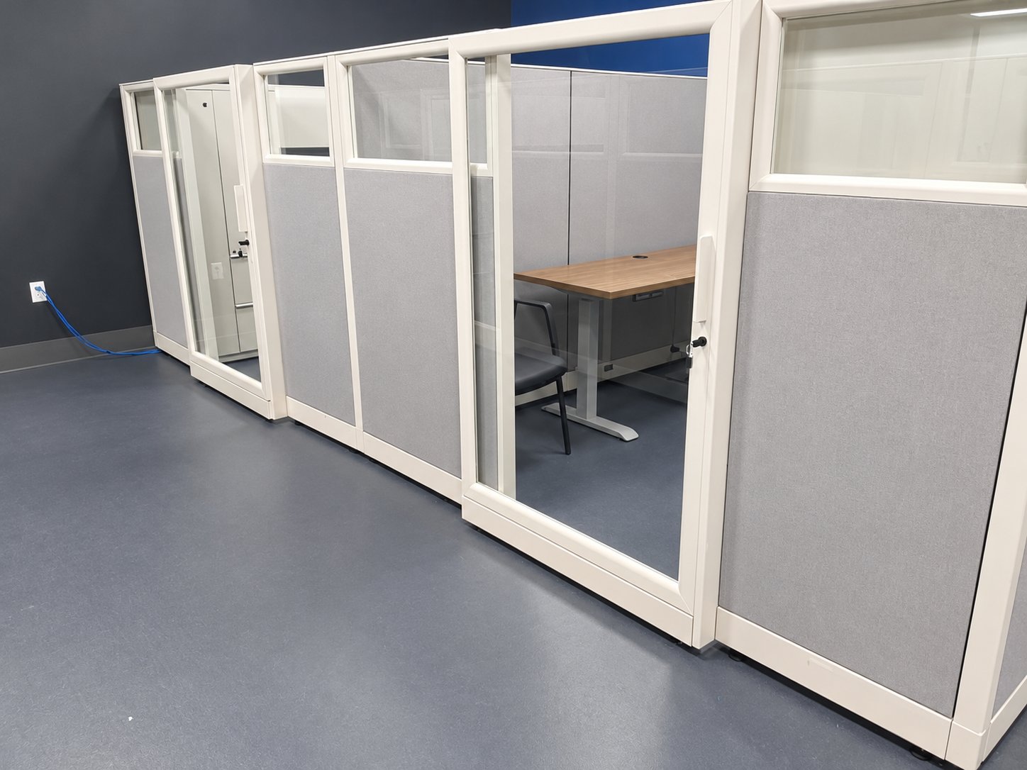 Port Houston glass door workstation furnished by Office Furniture Connection