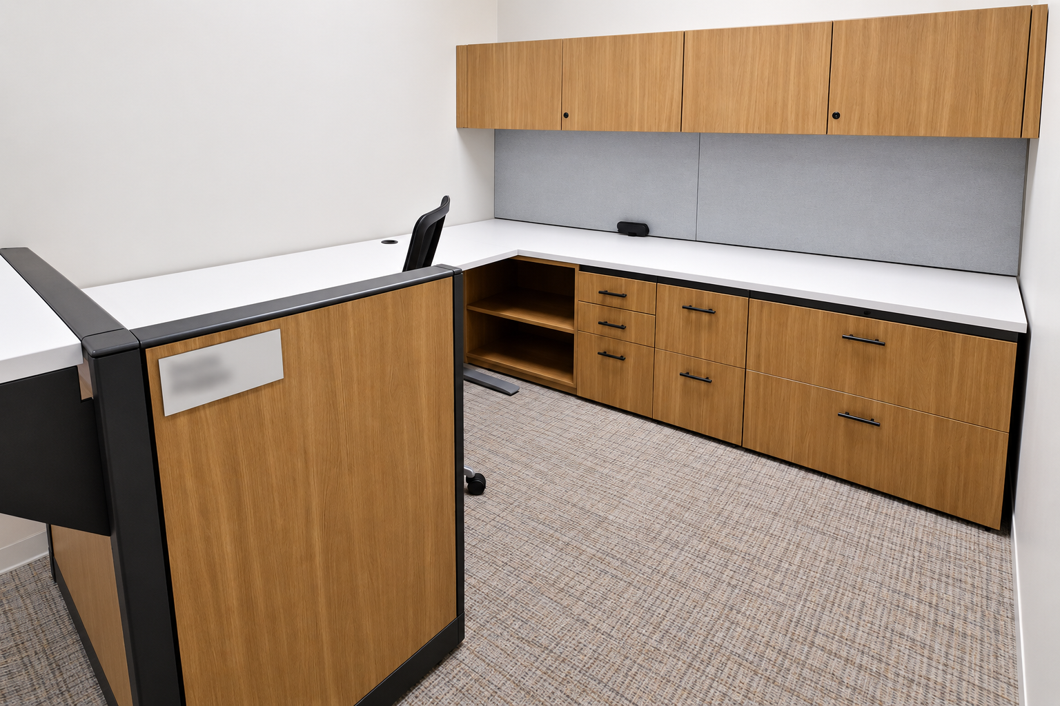 Law firm shared counter and storage with white work surfaces and wood finish cabinets.