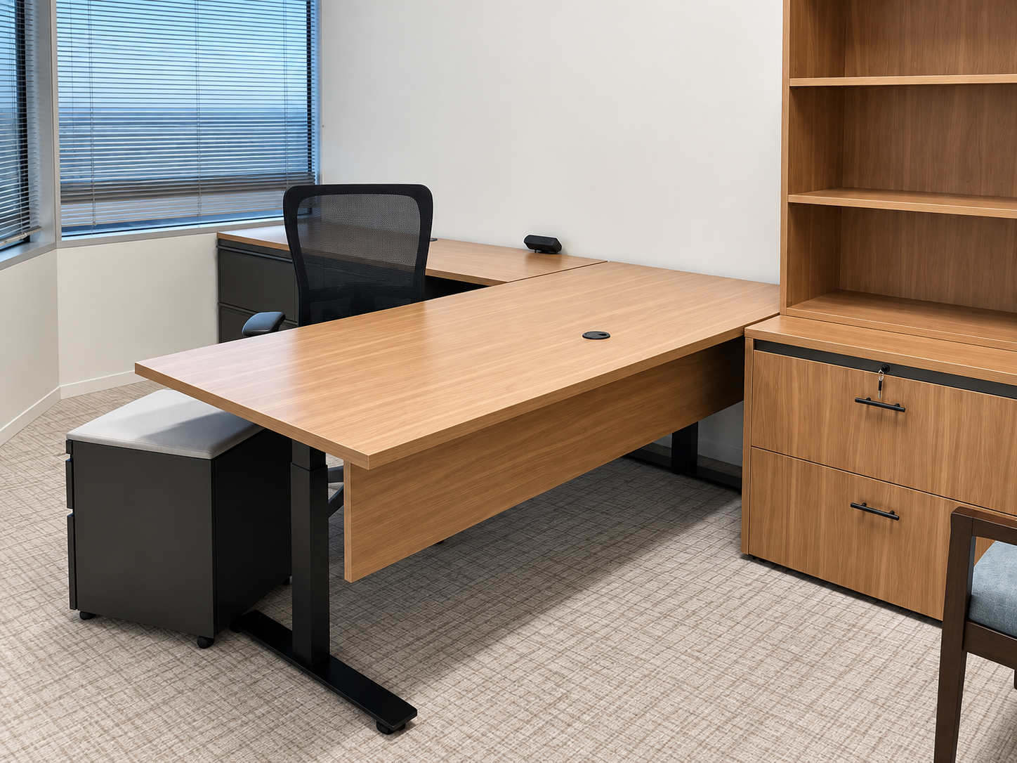 Private office with a light wood finish desk, shelving, and storage.