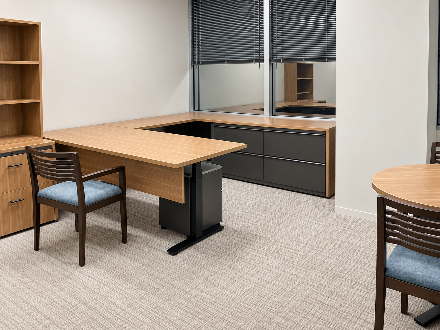 Law firm private office with desk, guest seating, and surrounding storage.