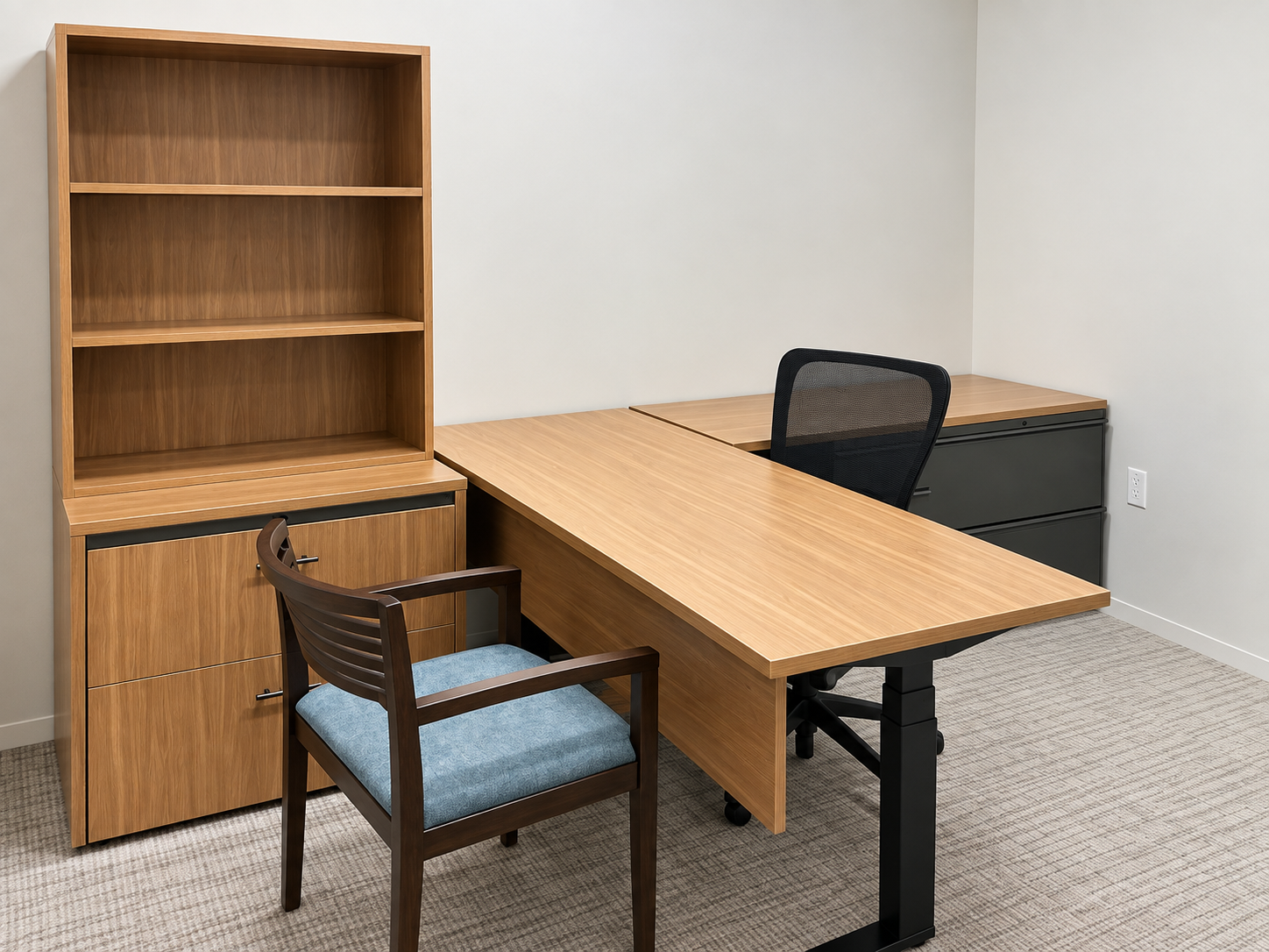 Alternate view of a private office with light wood finish desk and shelving.