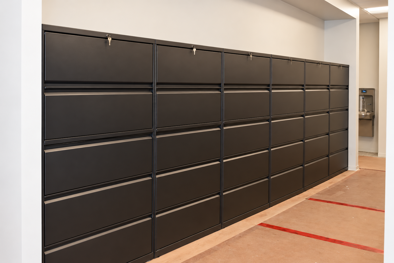 Bank of dark lateral filing cabinets at a Houston law firm.